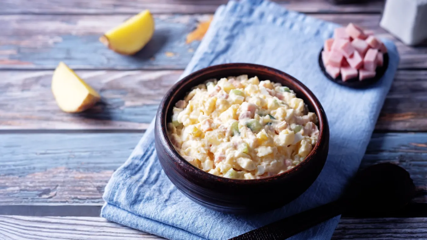 Ham,And,Potato,Salad,In,A,Bowl,On,A,Wood