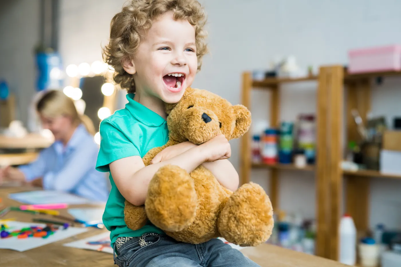 Warm,Toned,Portrait,Of,Happy,Curly,Haired,Kid,Laughing,Cheerfully