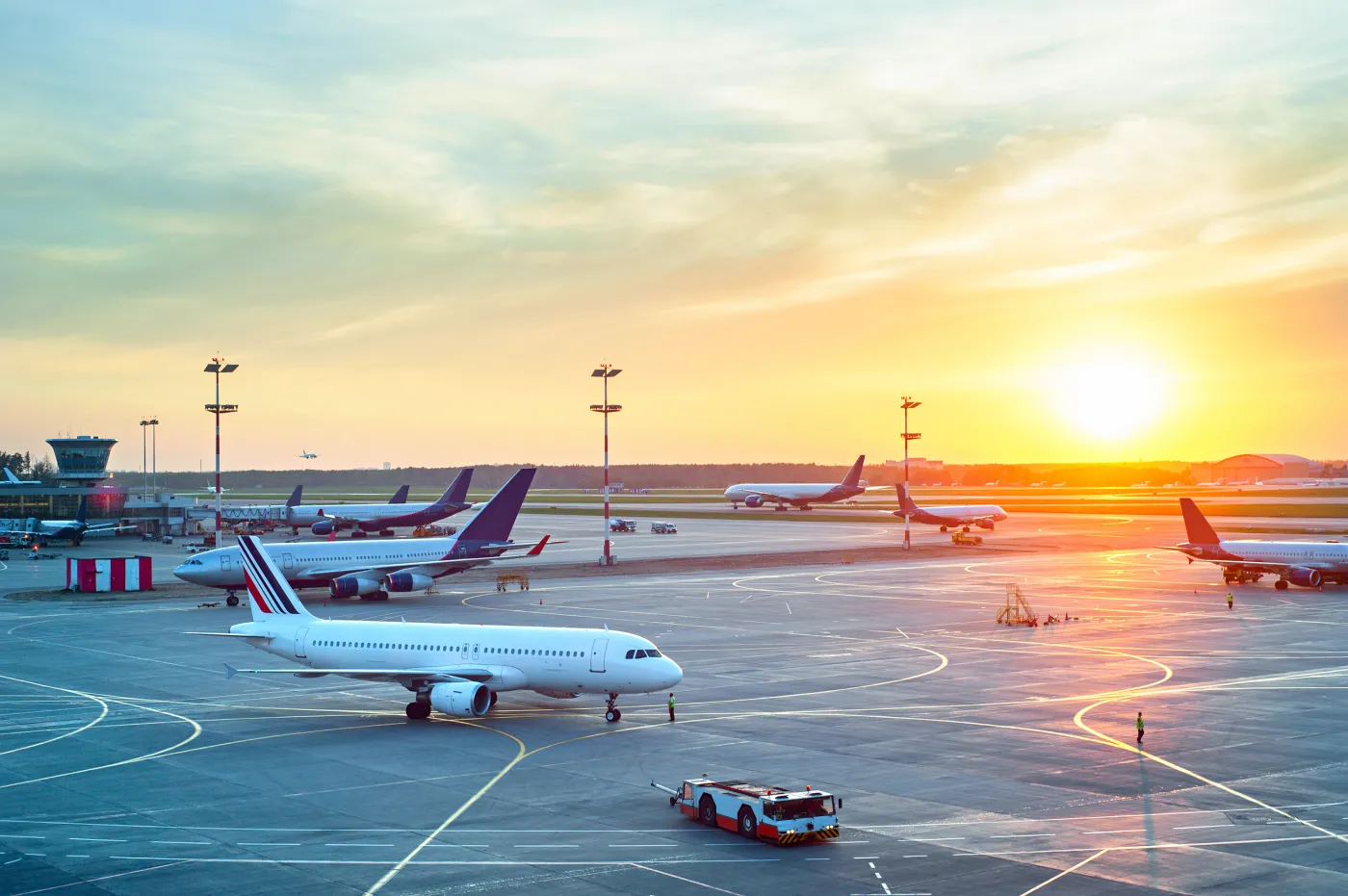 Lotnisko Airport,With,Many,Airplanes,At,Beautiful,Sunset