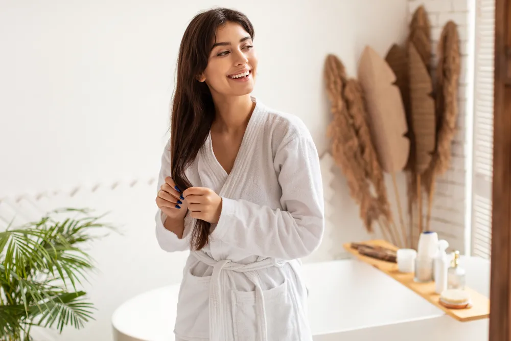 Haircare,Concept.,Joyful,Pretty,Woman,In,Bathrobe,Touching,Long,Brunette