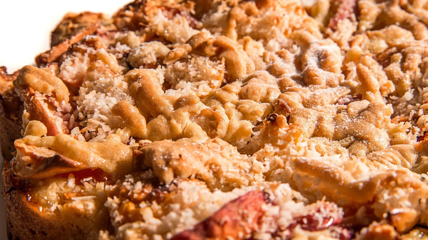 Delicios,Coconut,Cake,With,Apples,And,Plums.isloated,On,White,Bckground