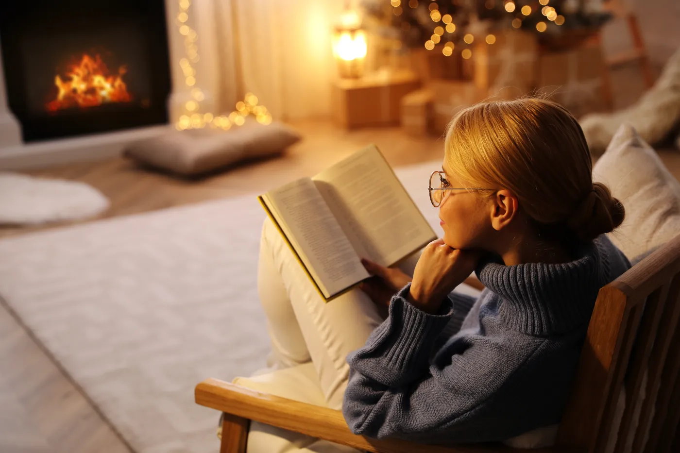 Young,Woman,Reading,Book,At,Home,,Space,For,Text.,Christmas