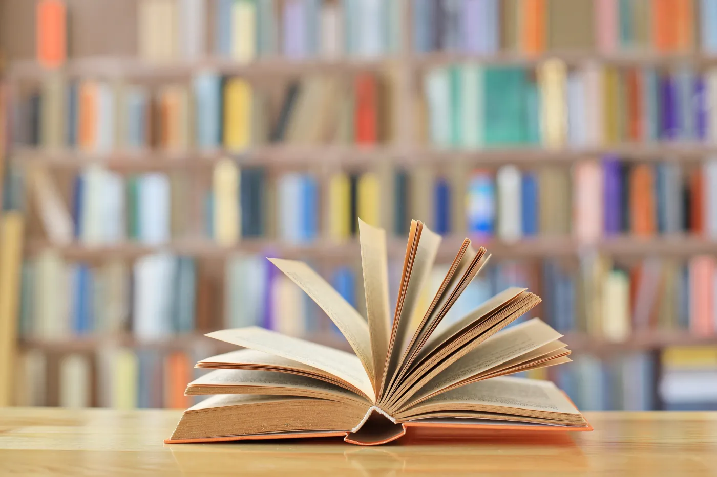 Book,With,Open,Pages,,Close,Up,,Books,On,The,Shelf