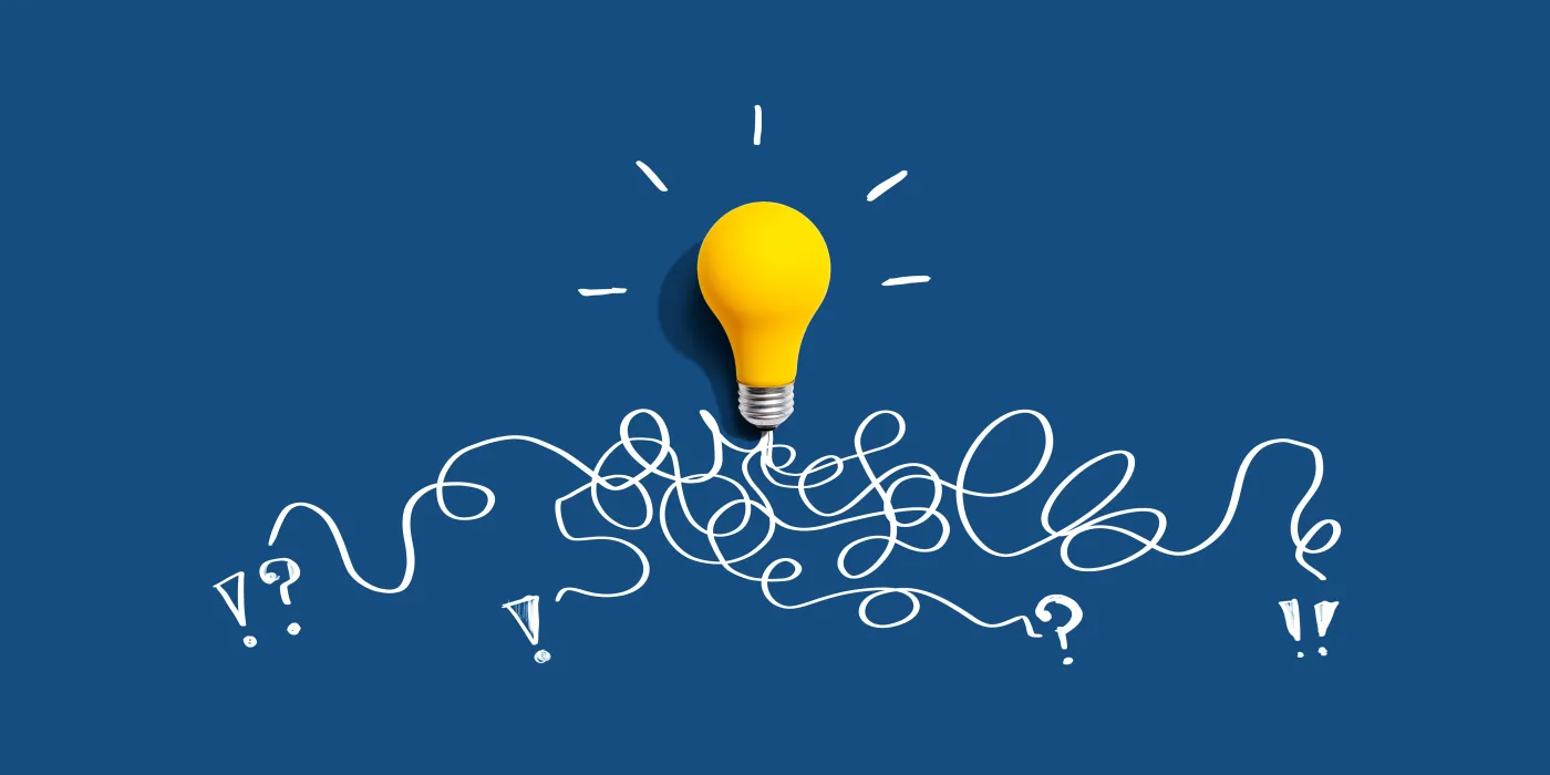 Brainstorming,Concept,With,A,Yellow,Light,Bulb,-,Flat,Lay