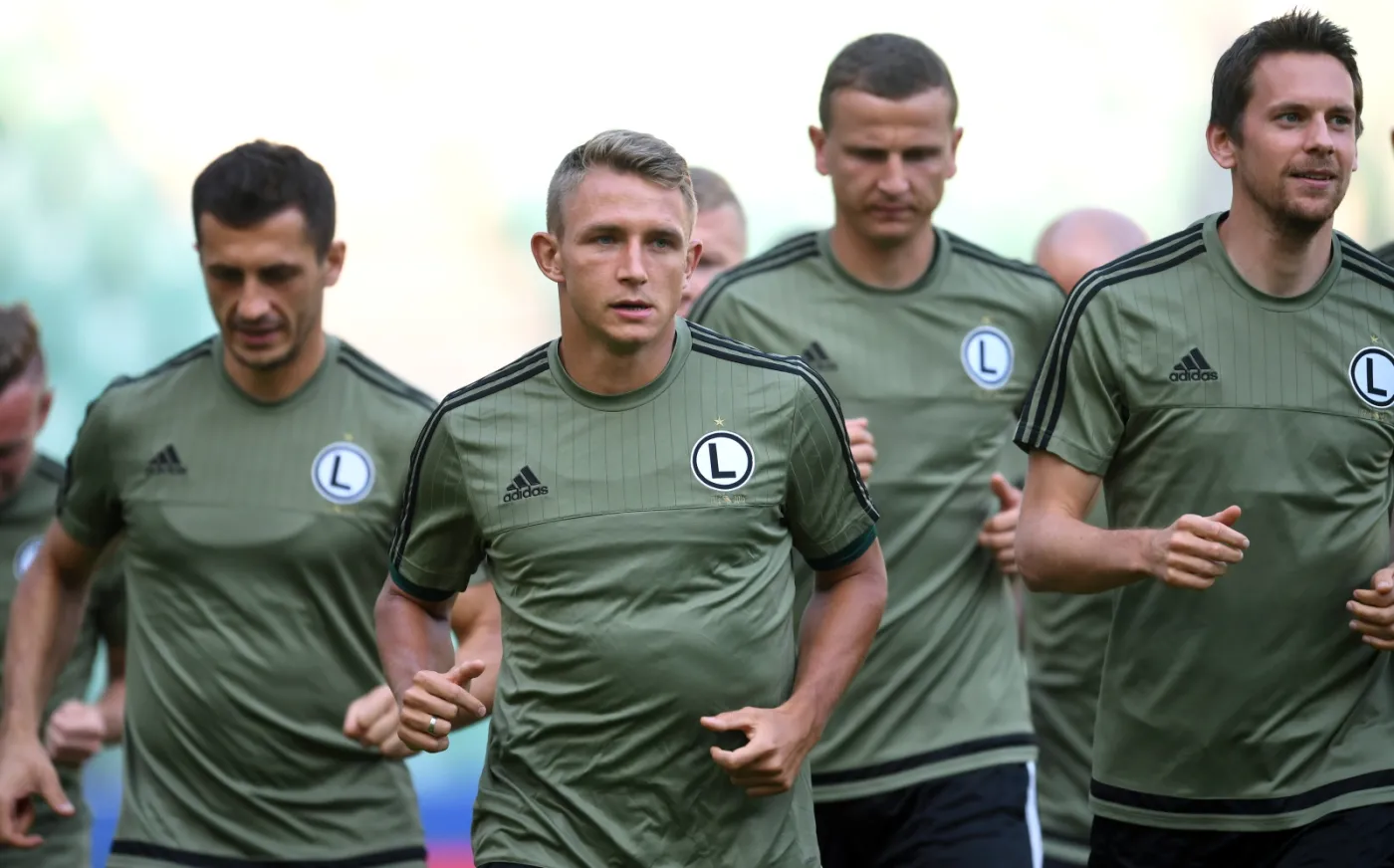 Jakub Rzeźniczak (C), Tomasz Jodłowiec (L) i Kasper Hamalainen (P)