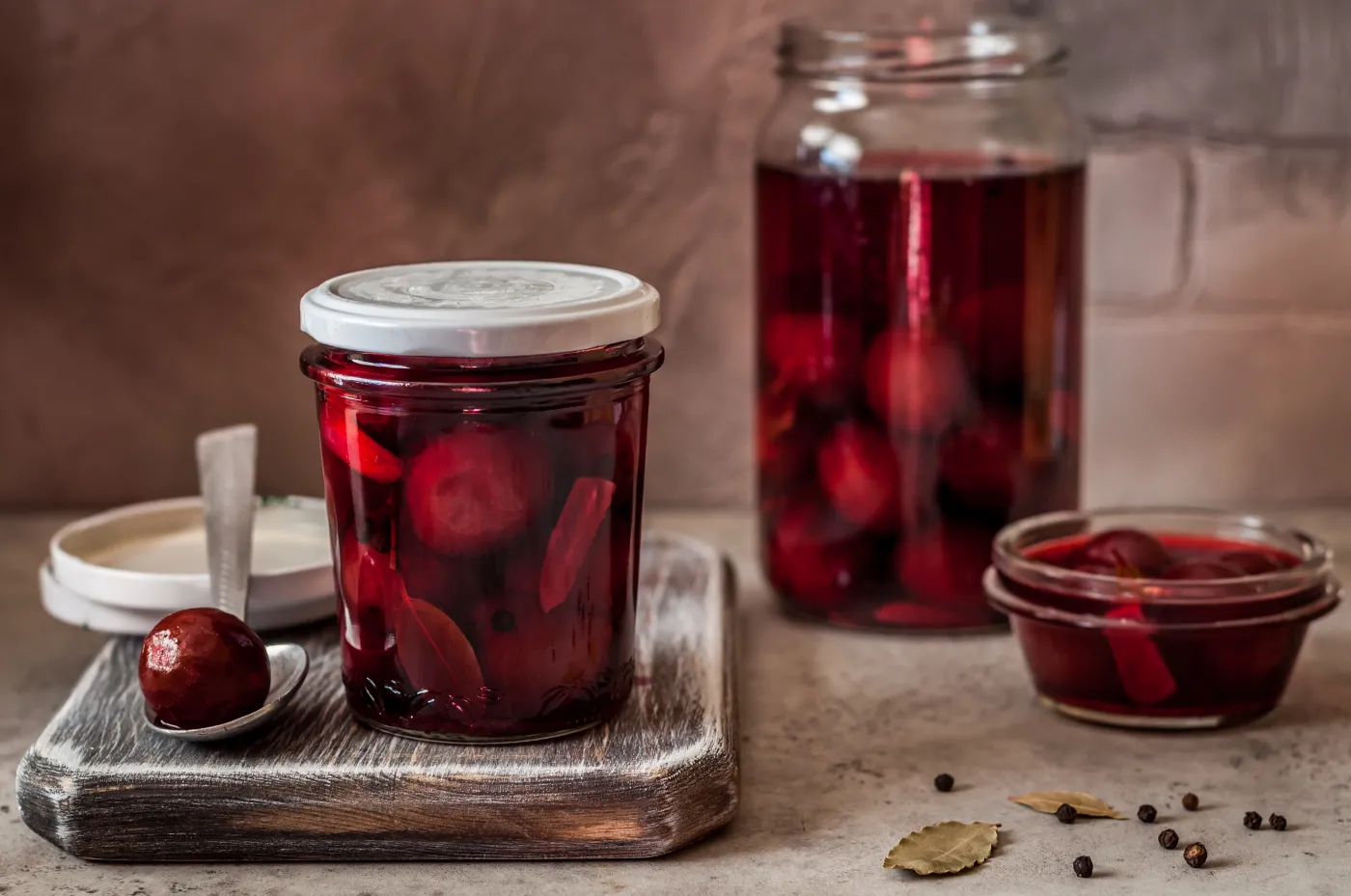 Canning,Pickled,Plums,In,Marinade,With,Bay,Leaf,,Garlic,And