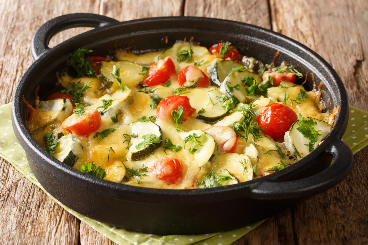 Vegetarian,Casserole,With,Zucchini,Cheese,And,Cherry,Tomatoes,Close-up,In