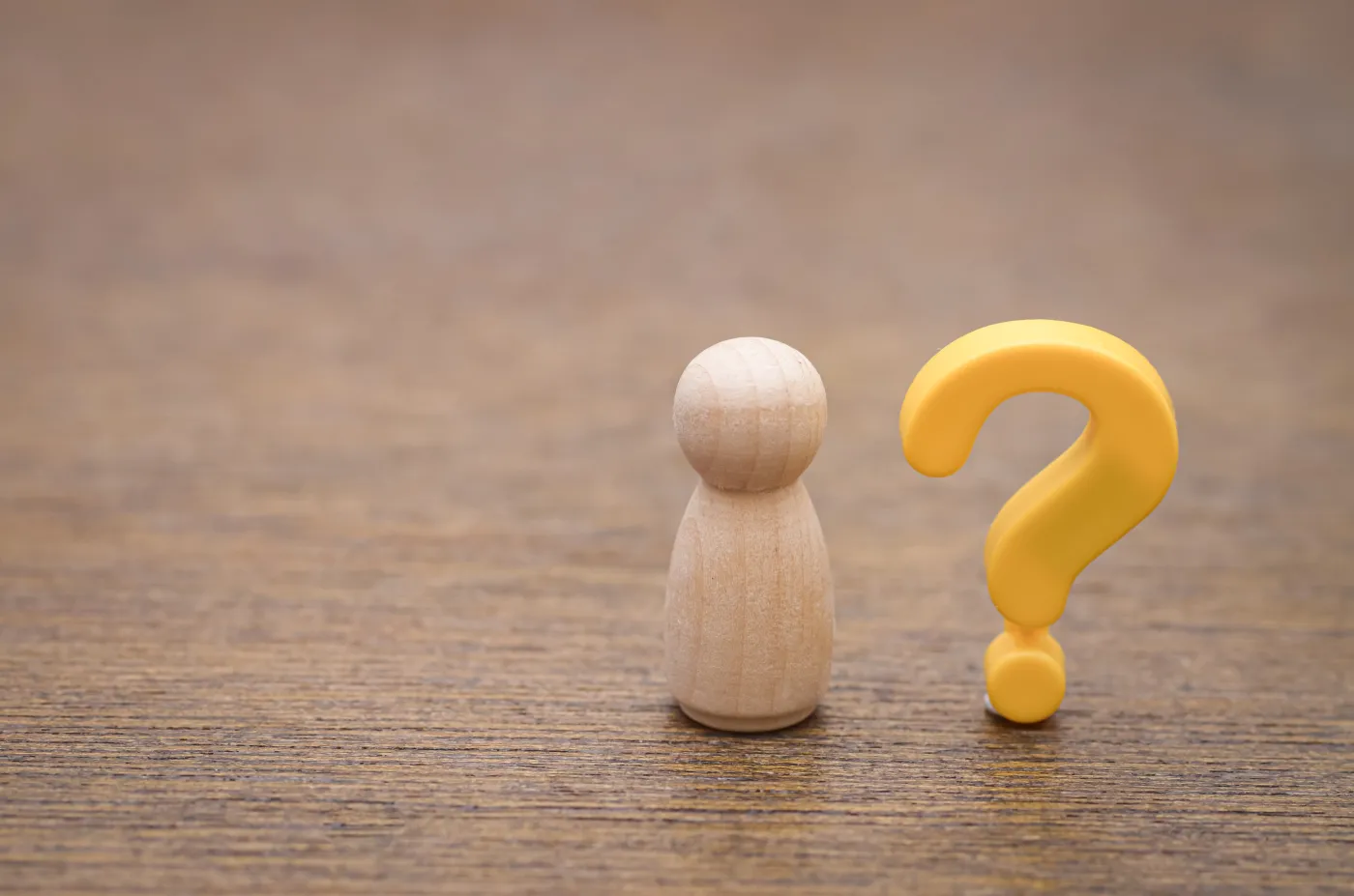 A,Simple,Wooden,Peg,Doll,With,A,Yellow,Question,Mark