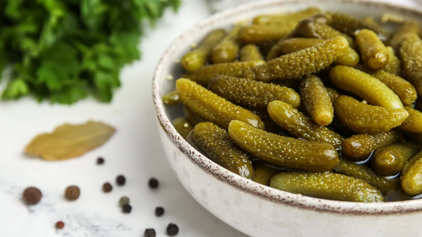 Bowl,With,Tasty,Pickled,Cucumbers,And,Different,Spices,On,White