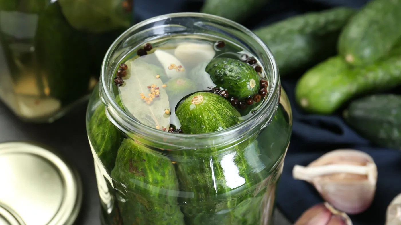 Making,Pickles.,Fresh,Cucumbers,And,Spices,In,Jar,On,Table,