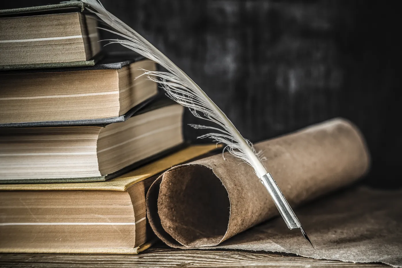 Old,Quill,Pen,With,Old,Paper,Scroll,And,Books,On