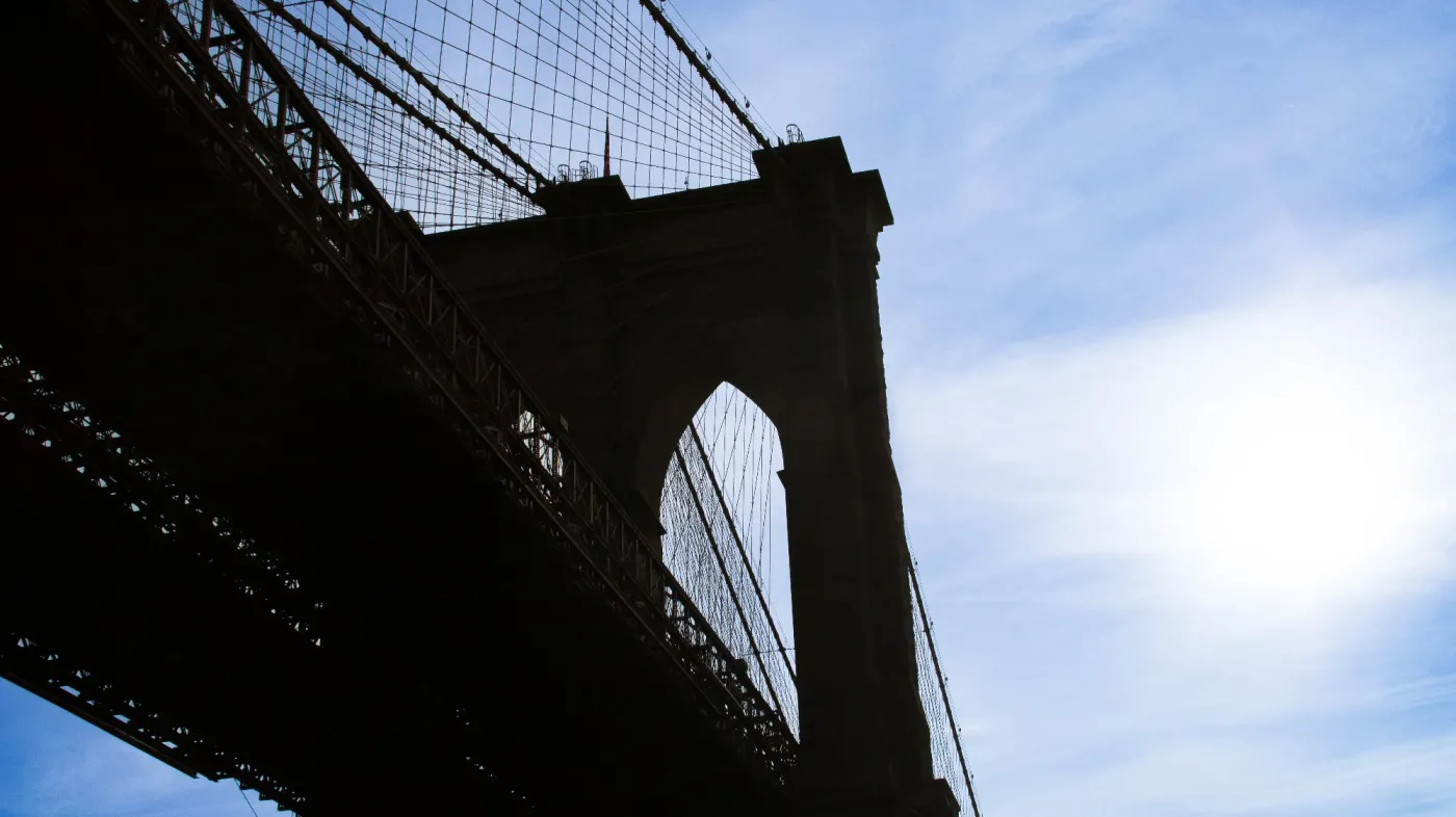 Silhouette,Of,The,Brooklyn,Bridge,From,The,Manhattan,Skyline,At