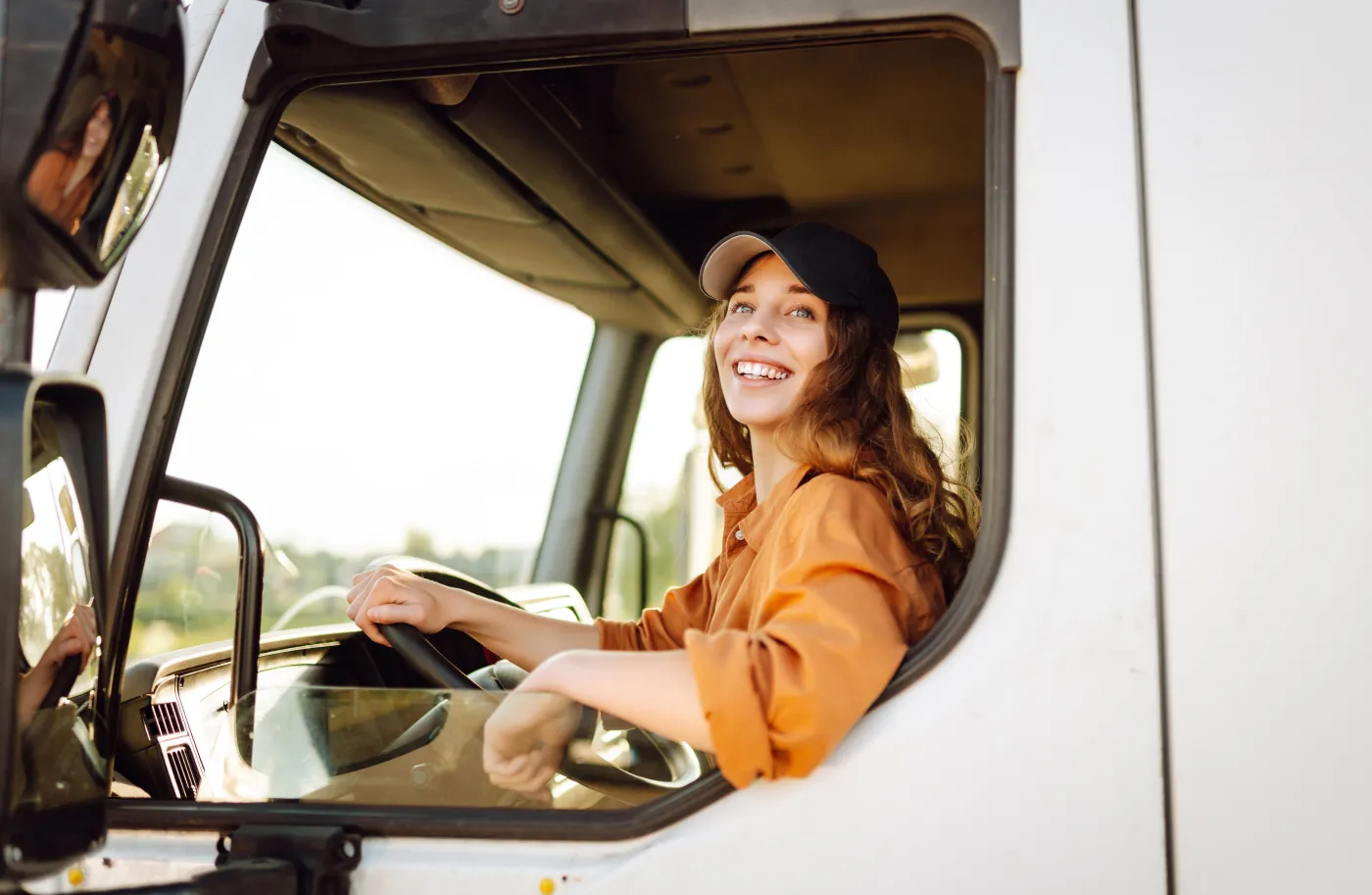 Kobieta kierowca za kierownicą Female,Driver,Looking,Out,Of,Truck,Window.,Transport,Industry,Theme