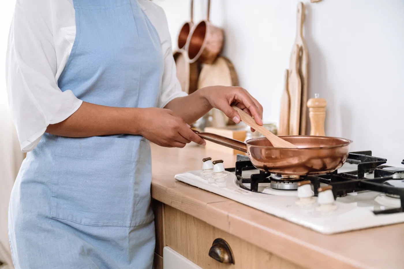 Cropped,Shot,Of,Female,Hands,Holding,Wooden,Spatula,And,Mixing