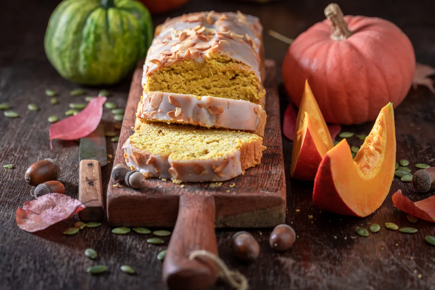 Aromatic,Pumpkin,Pound,Cake,With,White,Glaze,And,Almonds.,Pumpkin