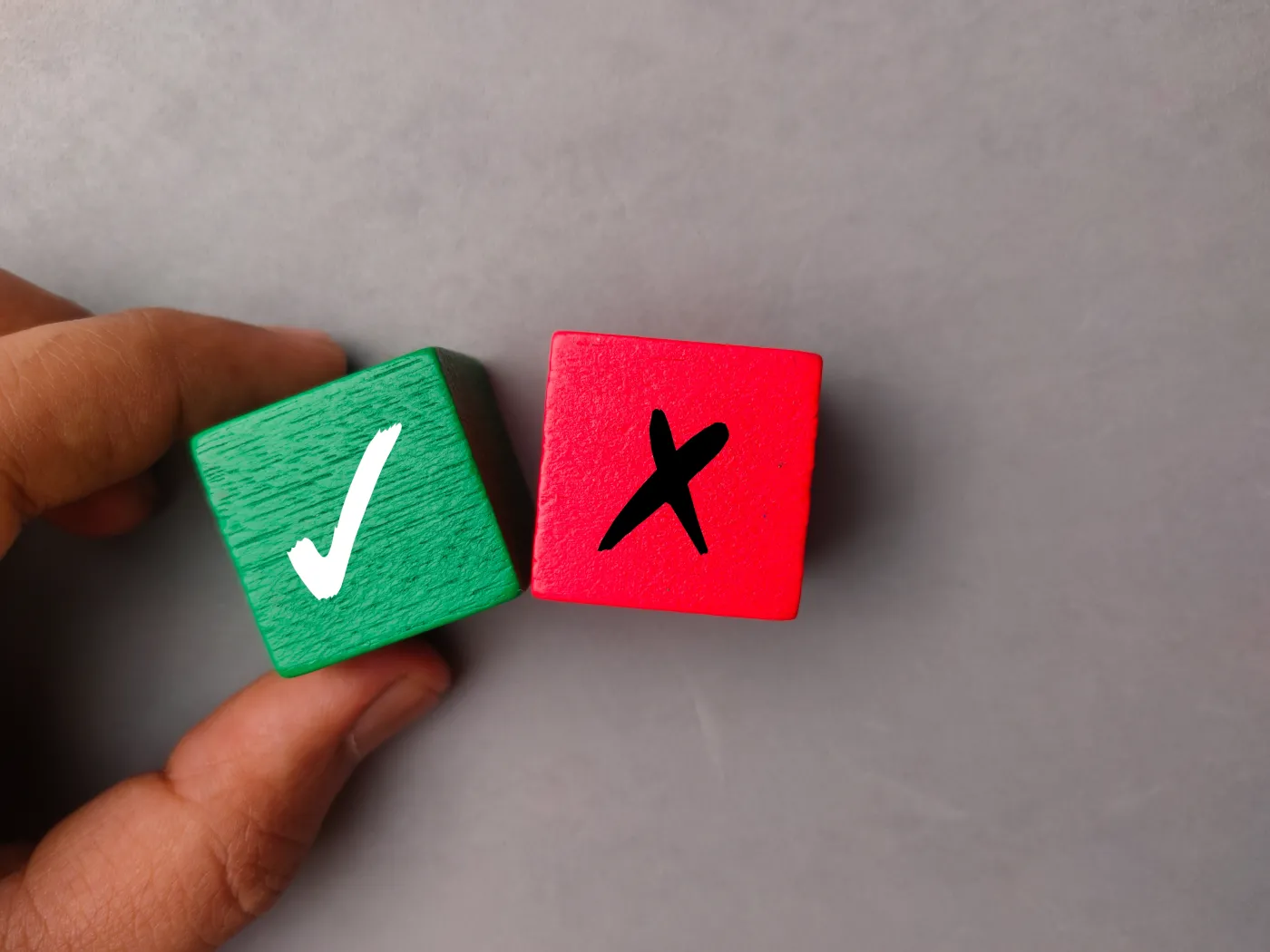 Top,View,Hand,Holding,Colored,Block,With,Symbol,Right,And