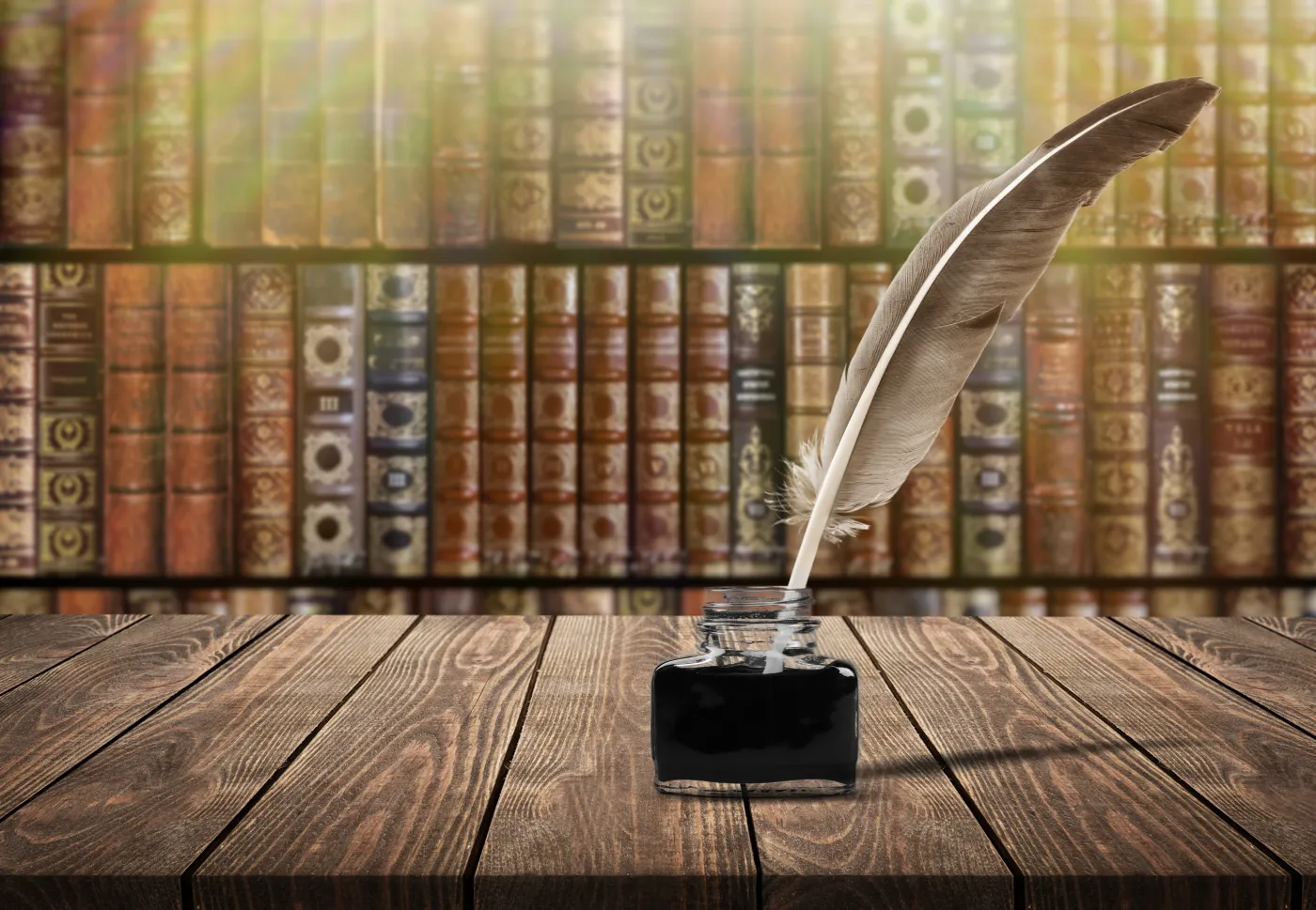 Feather,Quill,Pen,And,Glass,Inkwell,On,Desk