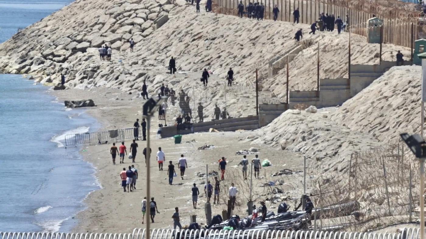 Migrants return to Morocco after crossing into Spanish North African enclave