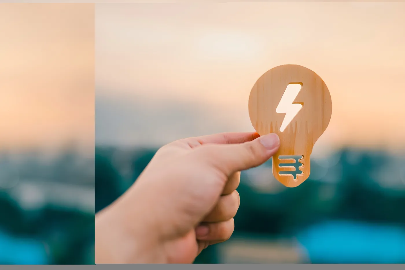 Hand,Holding,Wooden,Light,Bulb,Icon,With,Lightning,Symbol,,Representing