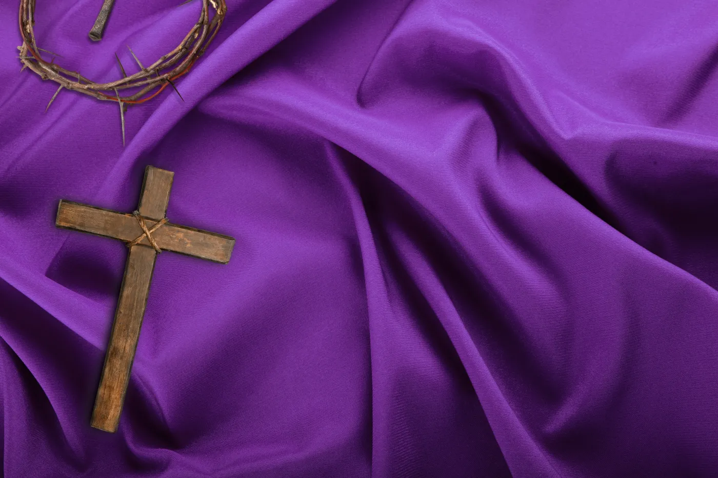 Wood,Cross,On,A,Dark,Fabric,Background