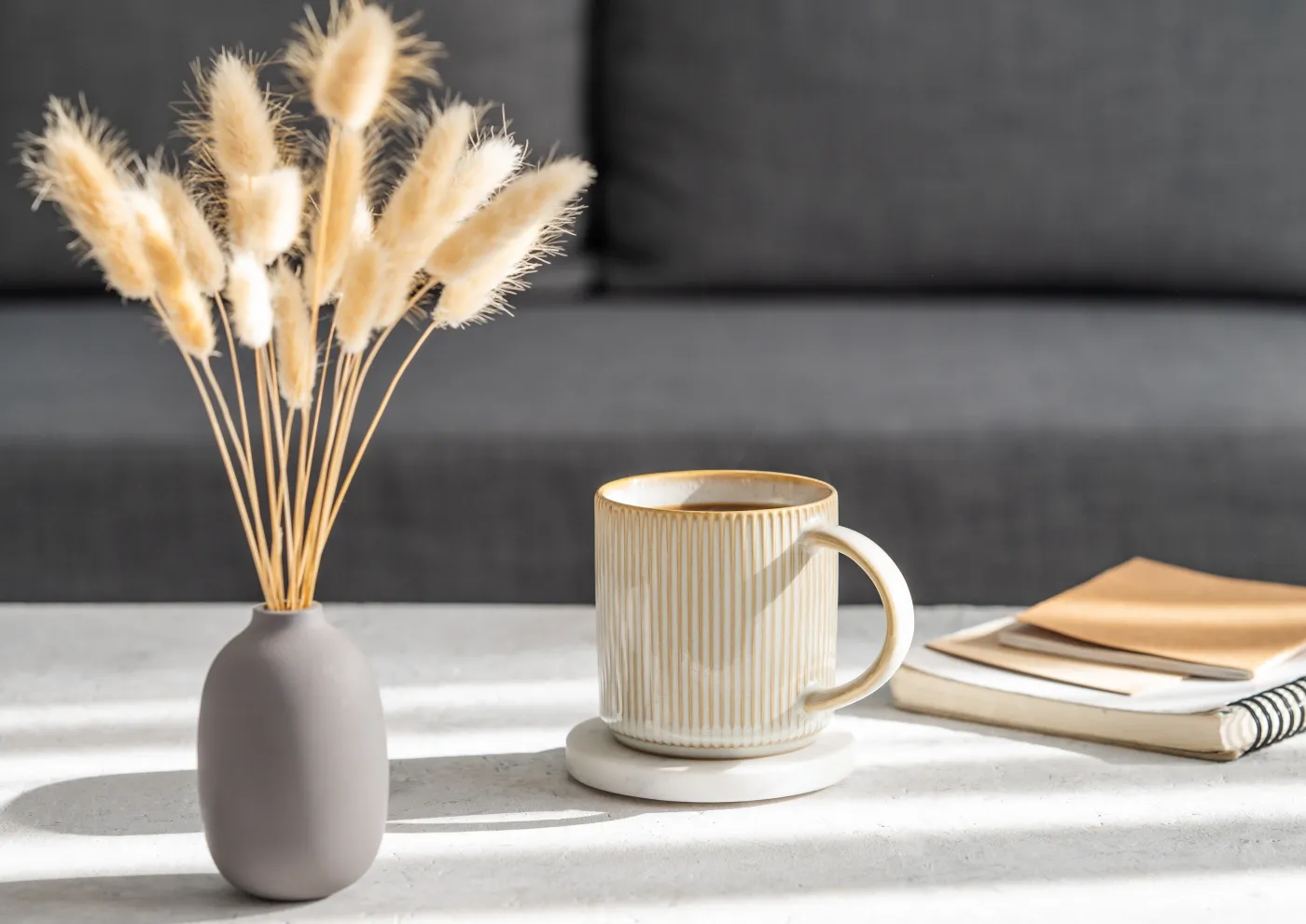 Beige,Cup,Of,Coffee,On,A,Light,Table,With,Soft