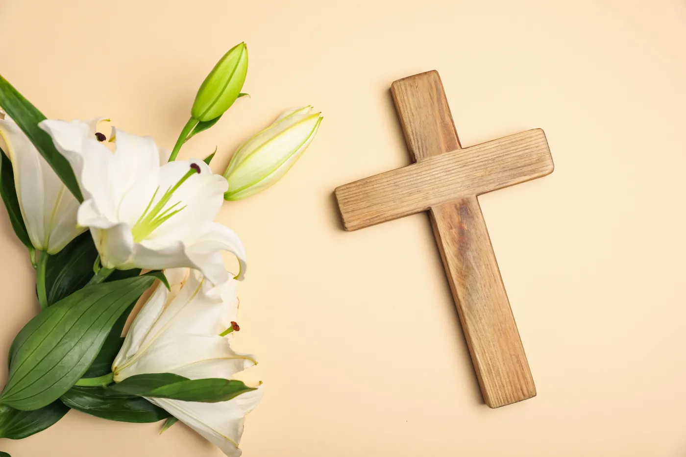 Easter.,Wooden,Cross,And,Beautiful,Lily,Flowers,On,Beige,Background,