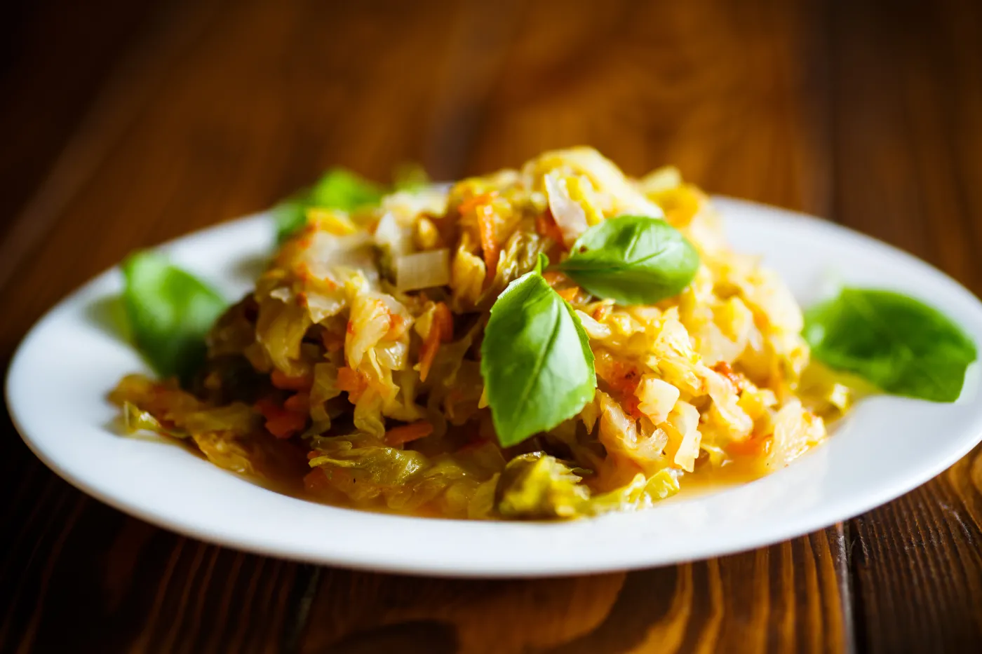 Stewed,Cabbage,With,Carrots,On,A,Wooden,Table