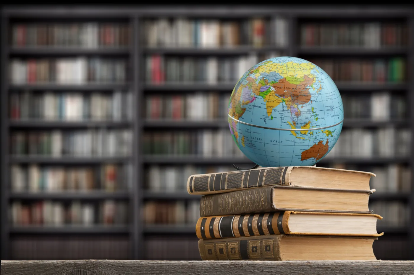 Old,Globe,On,Open,Book,In,Modern,Library.