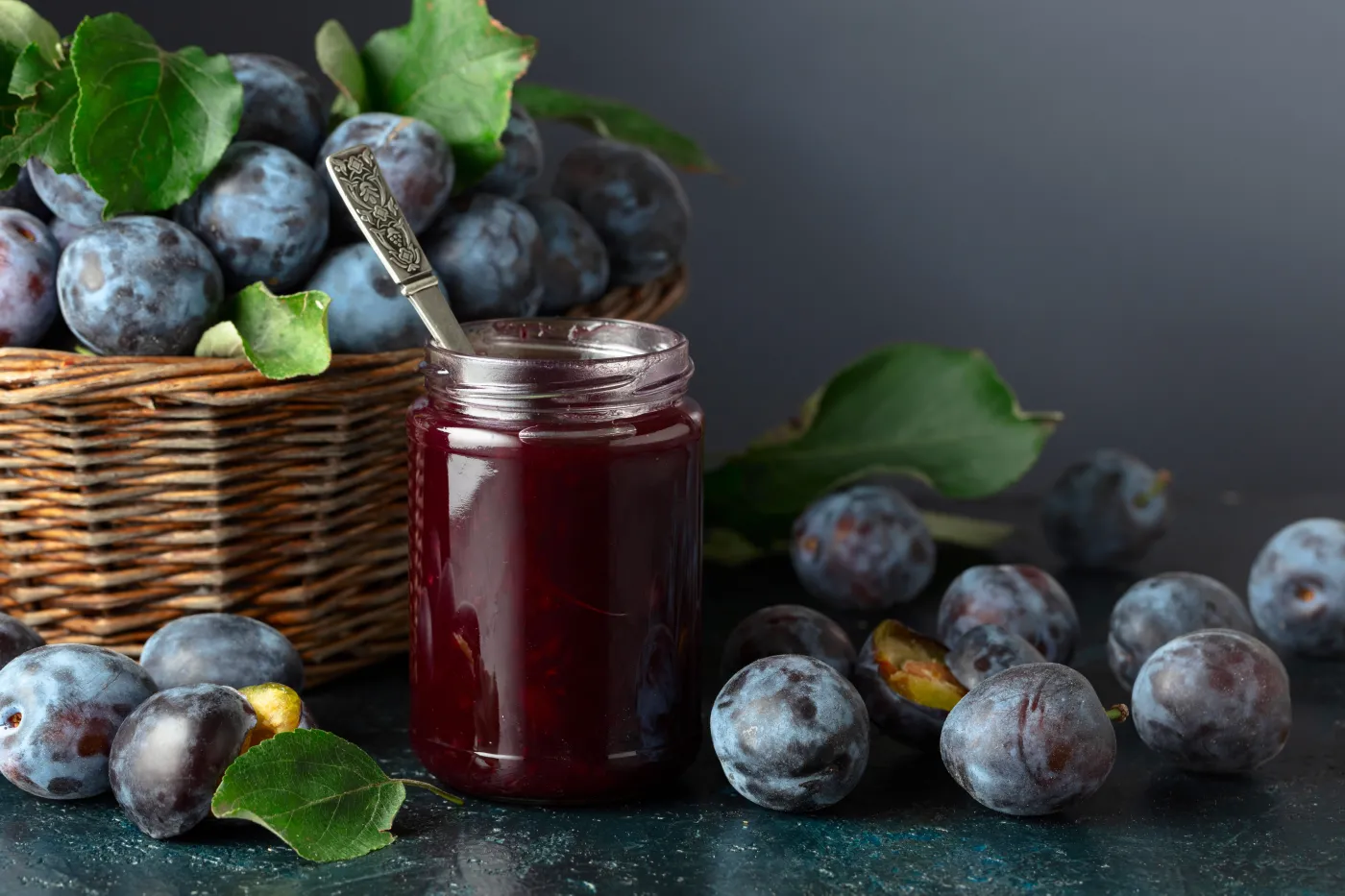 Plum,Jam,And,Fresh,Berries,On,A,Dark,Blue,Background.