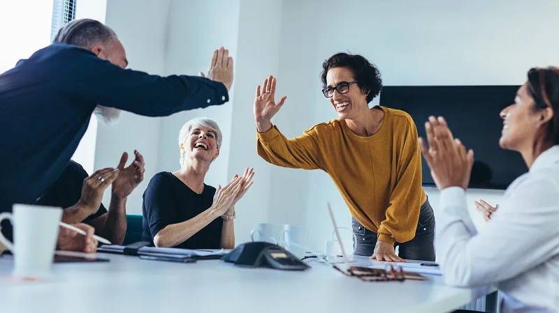 business-people-giving-each-other-high-five-and-clapping-business-team-celebrating-success-12617314.jpeg