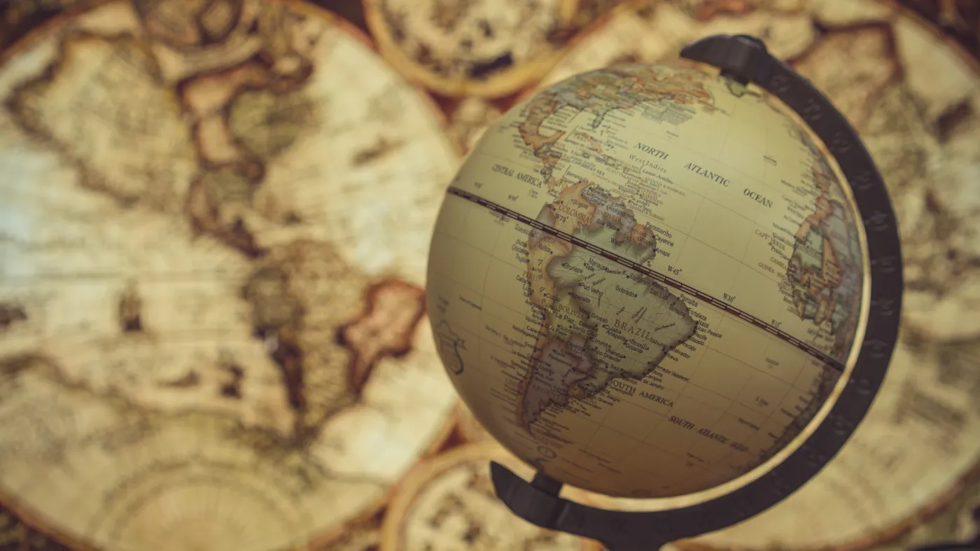 Globe,Model,And,Old,World,Map