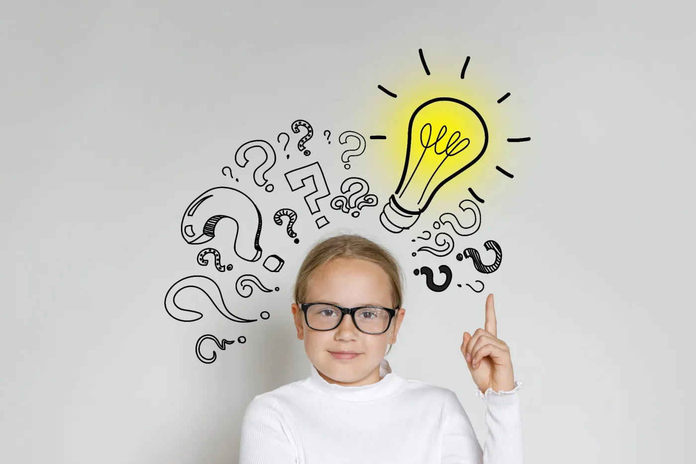 Clever,Child,Girl,With,Light,Bulb,And,Question,Marks,On