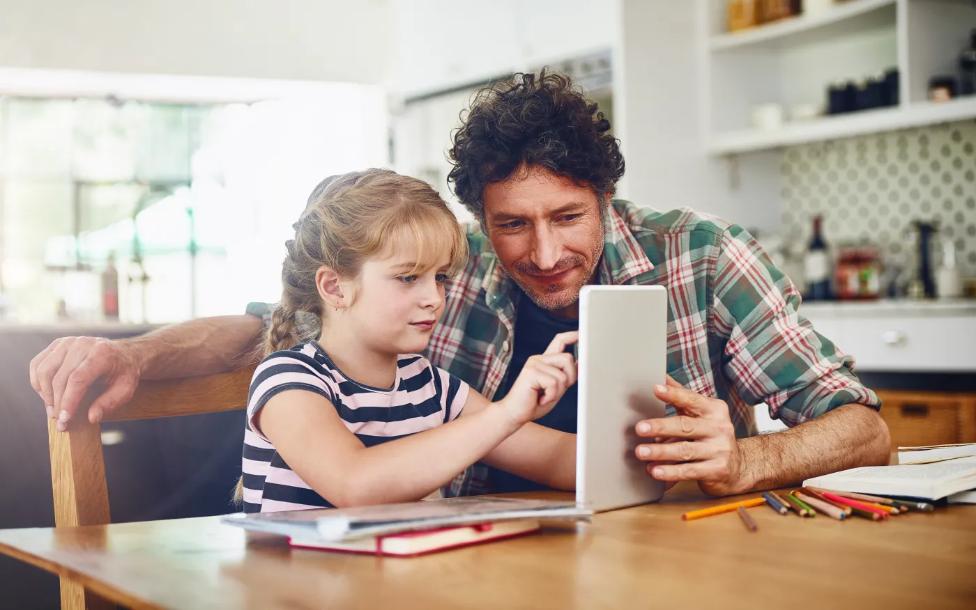 Home,,Dad,And,Daughter,With,Tablet,For,Homework,Or,Read