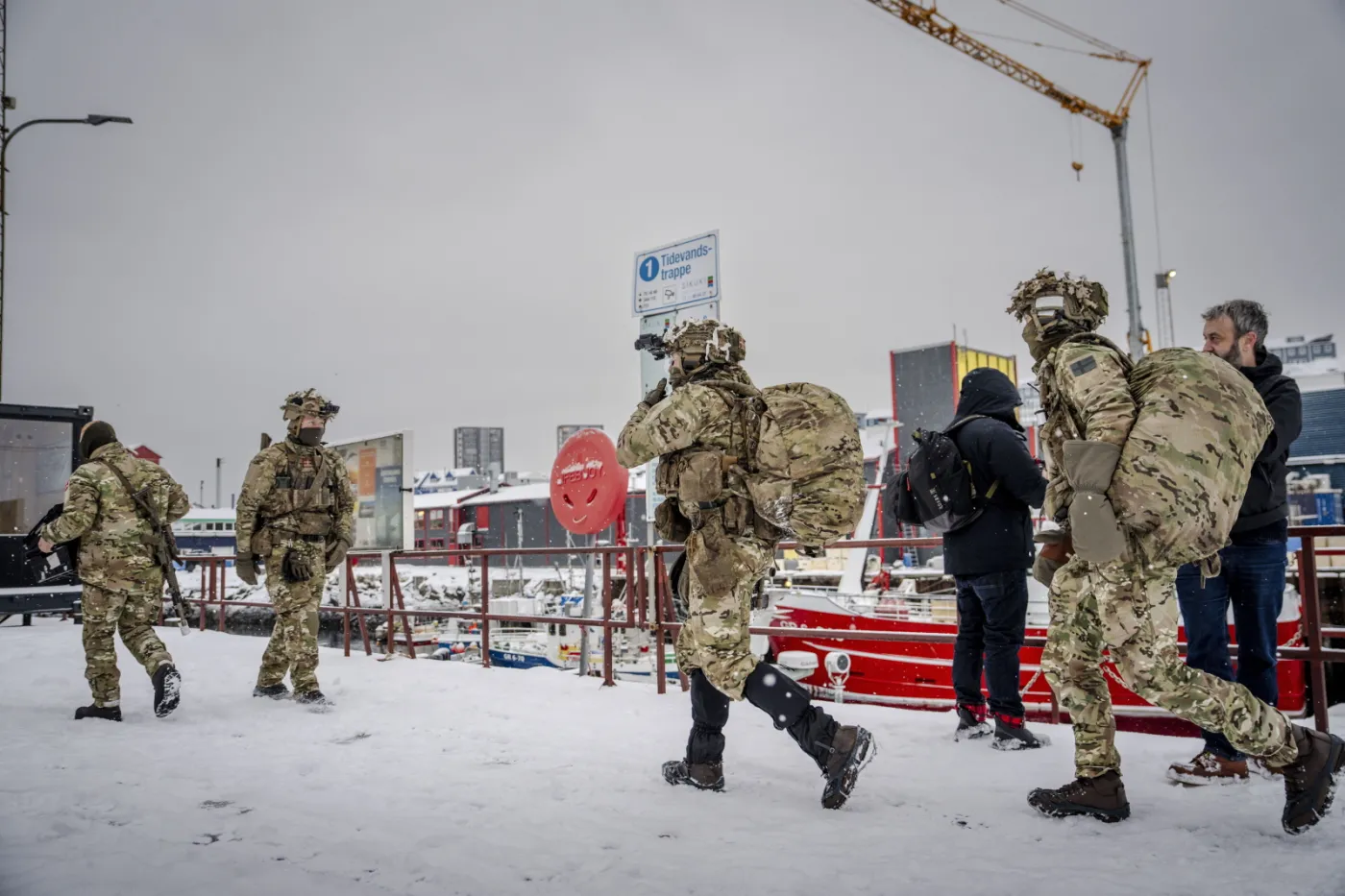 Danish soldiers disembark at the port in Nuuk
