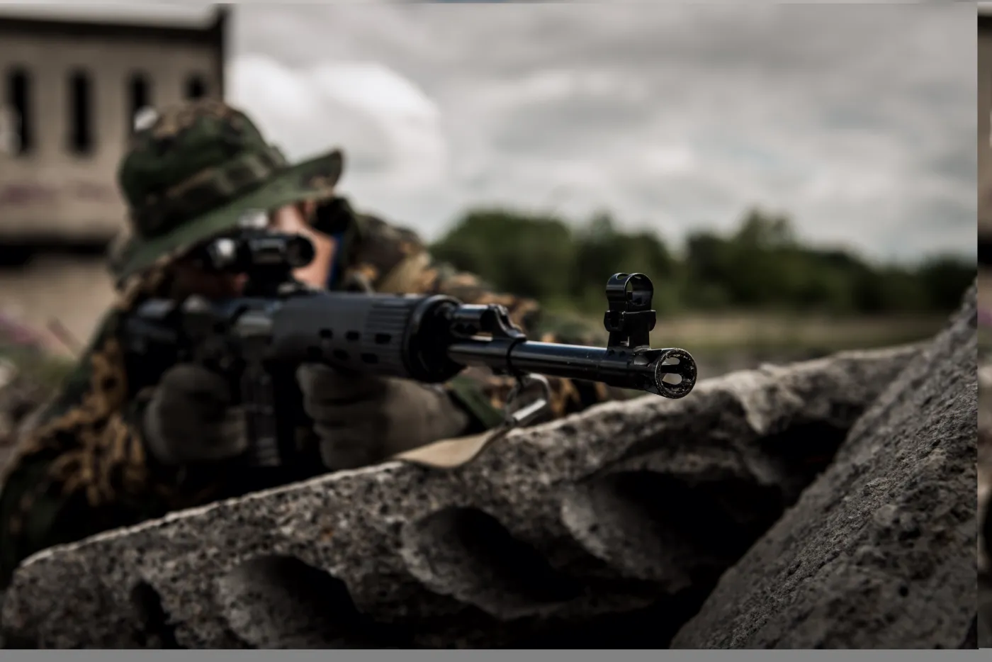 Russian,Sniper,Hidden,In,Urban,Area,-,Focus,On,Barrel