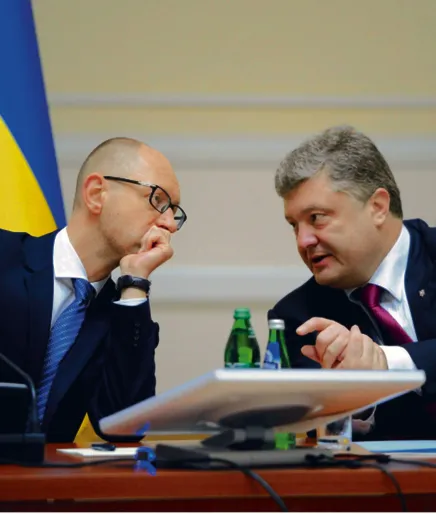 Arsenij Jaceniuk i Petro Poroszenko bronią hrywny
