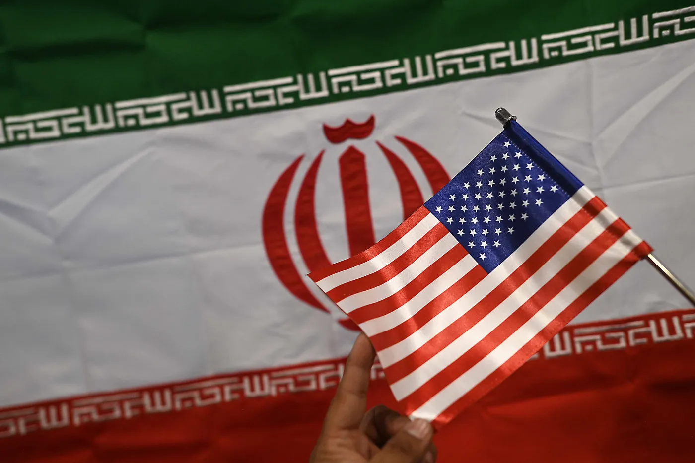 US, Iran and Pakistan flags on display at a shop in Karachi