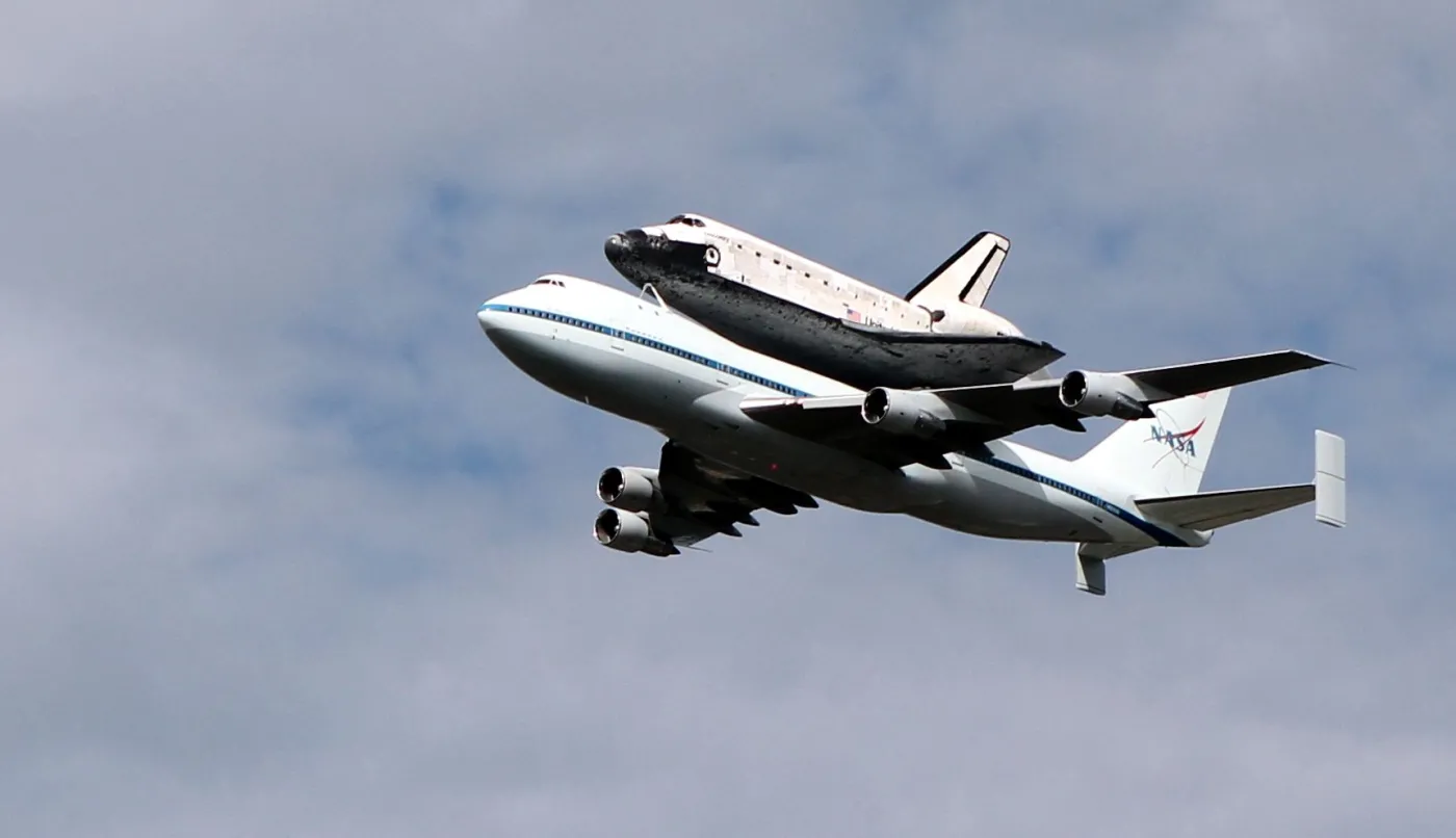 1238020-8-2-shutter-discovery-on-top-of-a-boeing-747-escorted-by-a-northrop-t-38-chase-plane.jpg