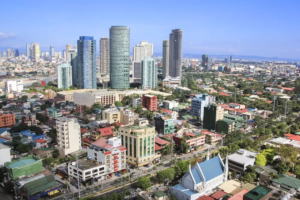 1360325-high-rise-condominiums-and-office-blocks-in-rockwell-part-of-crowded-makati-city-in-manila.jpg