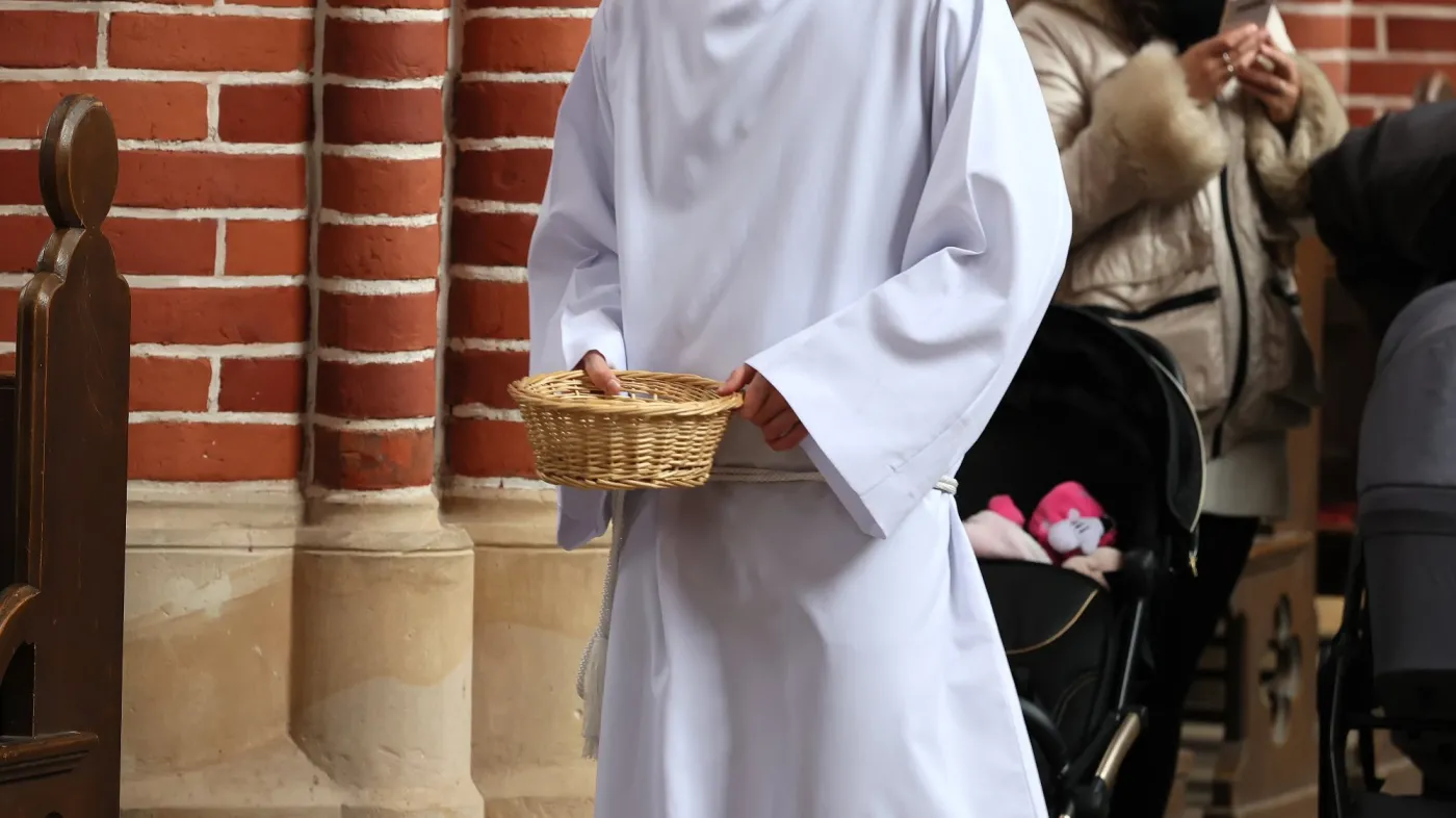The,Altar,Boy,Collects,Donations,To,The,Basket,From,The