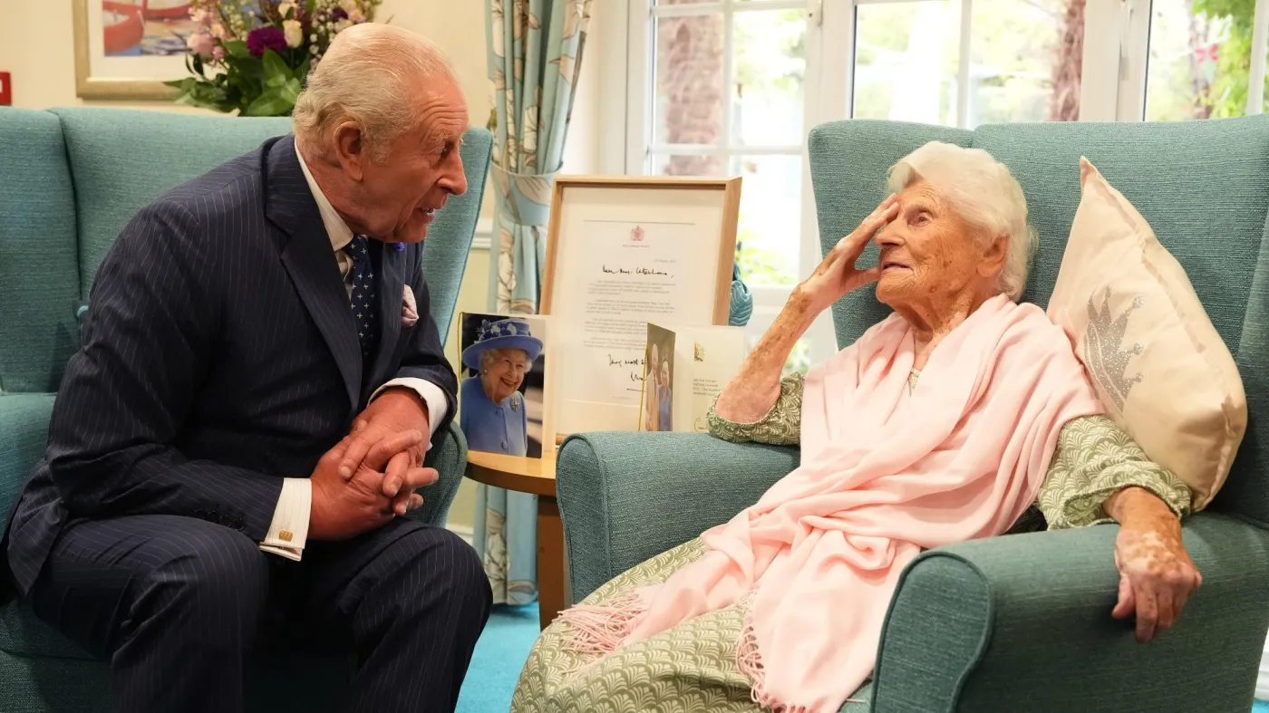 King Charles III meets world's oldest person